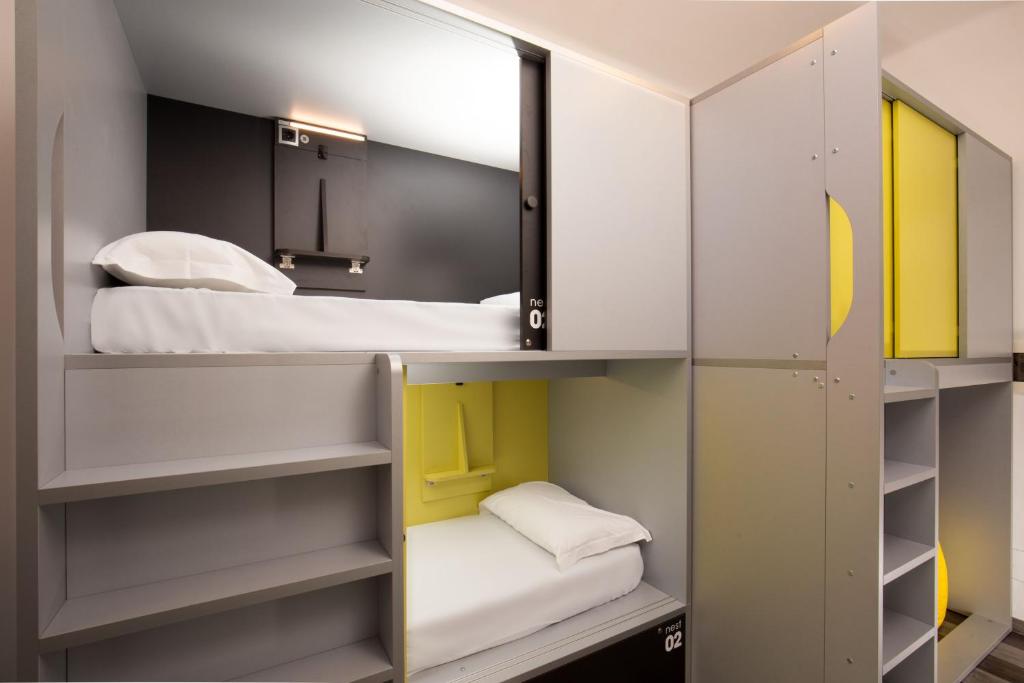 Postel nebo postele na pokoji v ubytování Free Hostels Roma