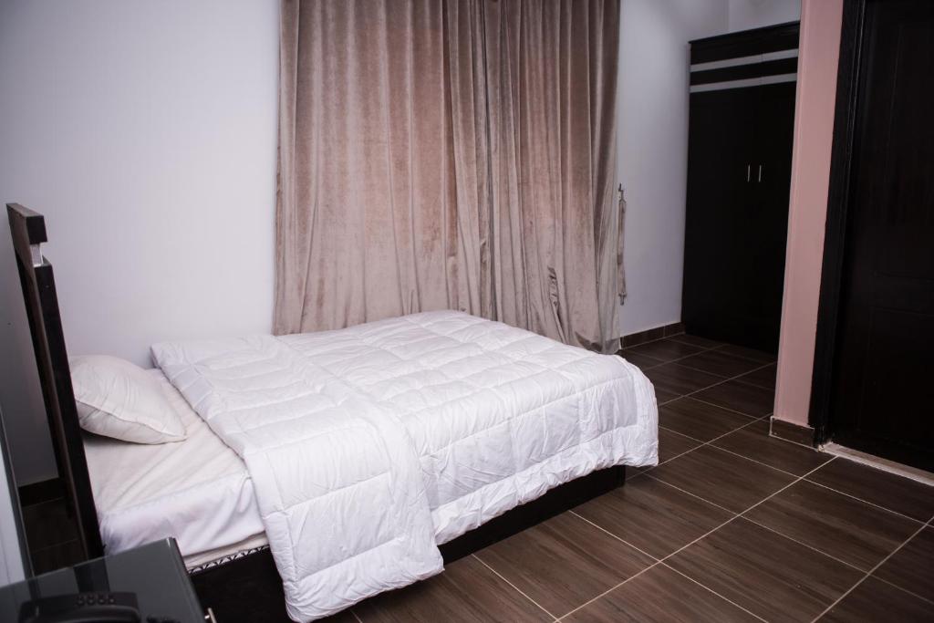 Ein Bett oder Betten in einem Zimmer der Unterkunft Hayat Pyramids View Hotel