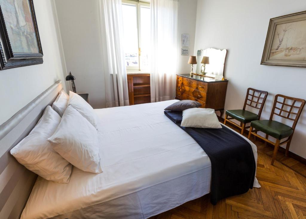 Posteľ alebo postele v izbe v ubytovaní Gianduja B&B