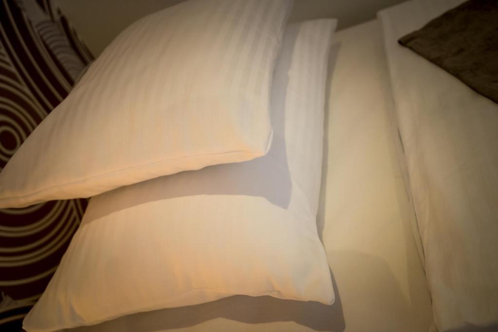 Postel nebo postele na pokoji v ubytování Mokka Apartman Szeged