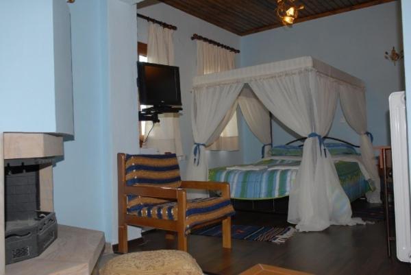 Ένα ή περισσότερα κρεβάτια σε δωμάτιο στο Natasa Rooms