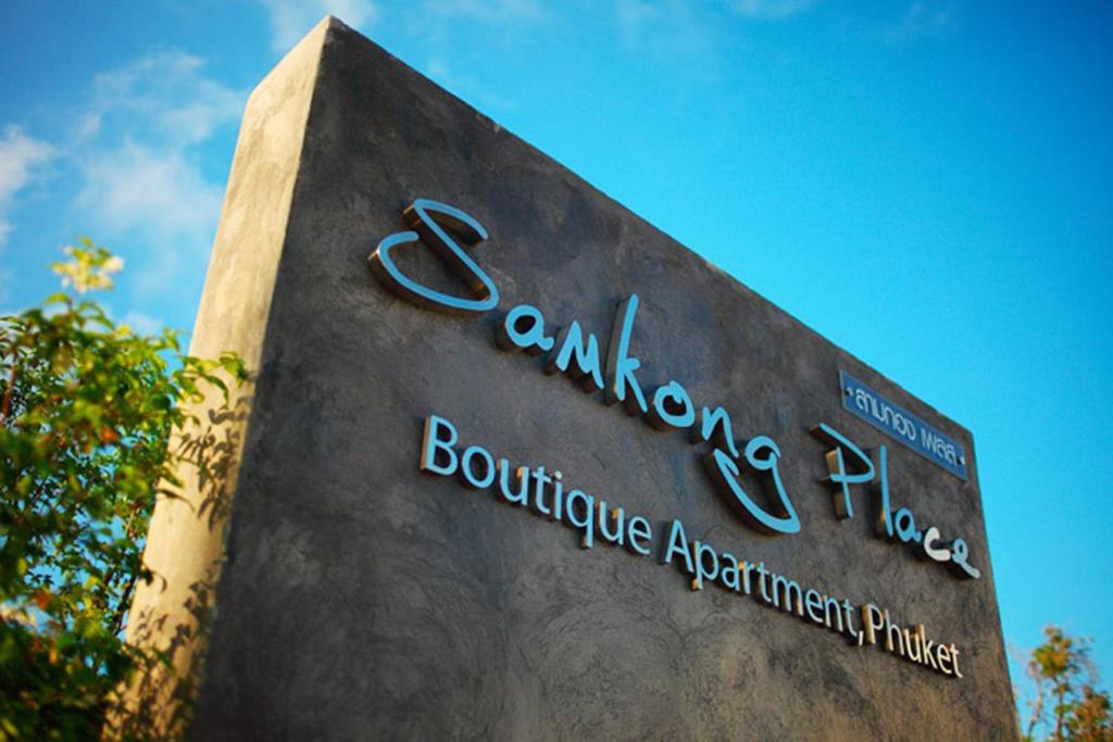 a sign for the building of the boulevarduce apartmentartmentartment at Samkong Place in Phuket