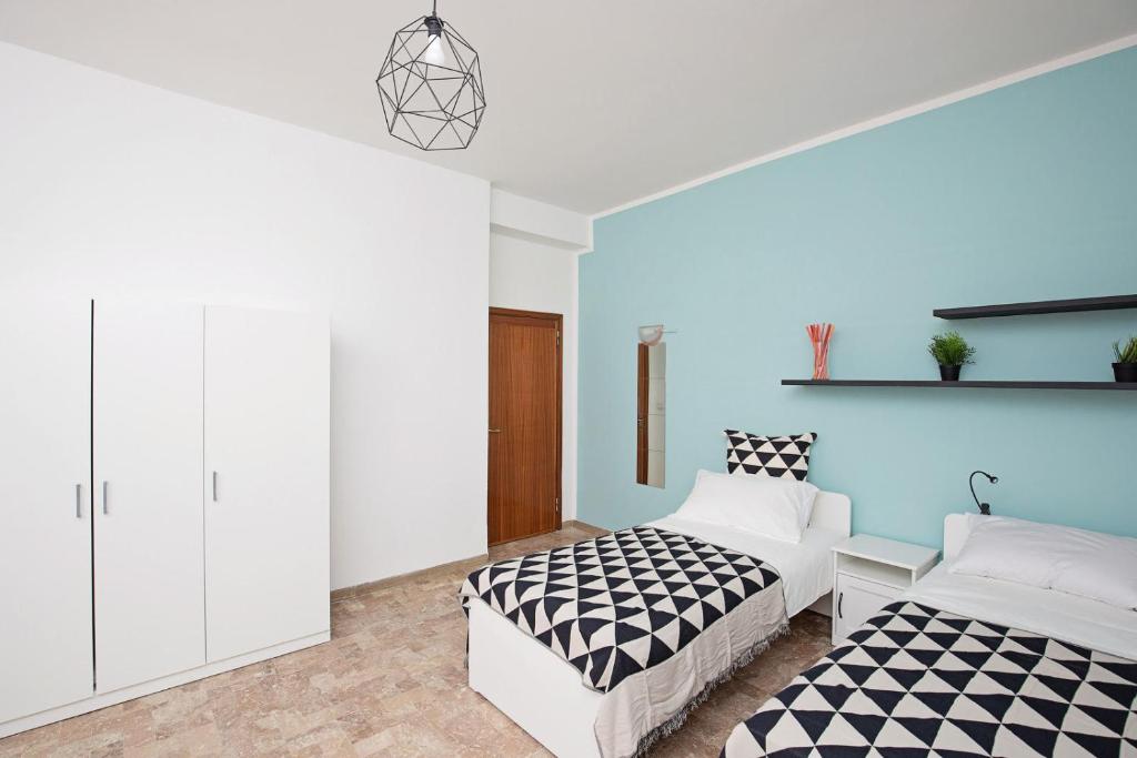 Postel nebo postele na pokoji v ubytování Ponte Tiberio Apartment