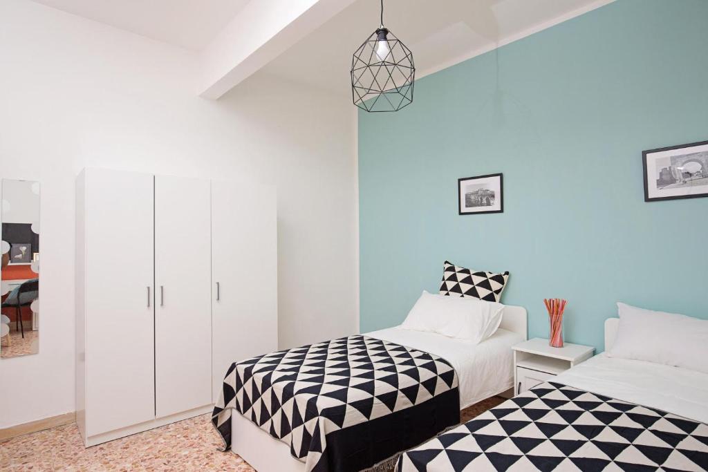 Postel nebo postele na pokoji v ubytování Ponte Tiberio Apartment