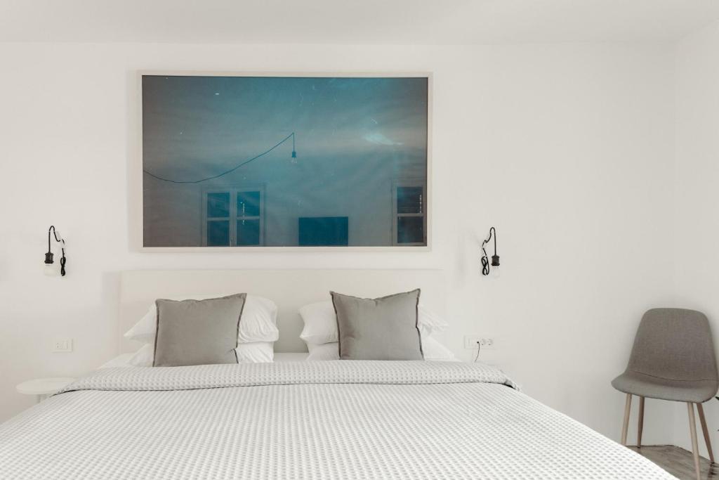 Una cama o camas en una habitación de Art Hotel Tartini