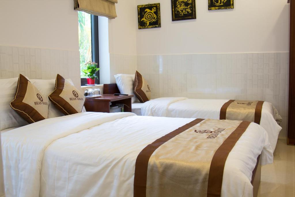 Postel nebo postele na pokoji v ubytování Bean Grass Homestay