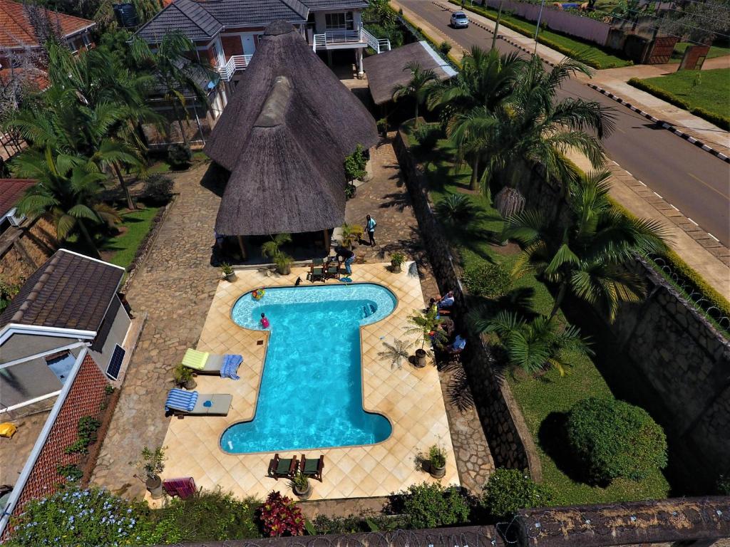 an overhead view of a swimming pool in a house at Entebbe Palm Hotel in Entebbe