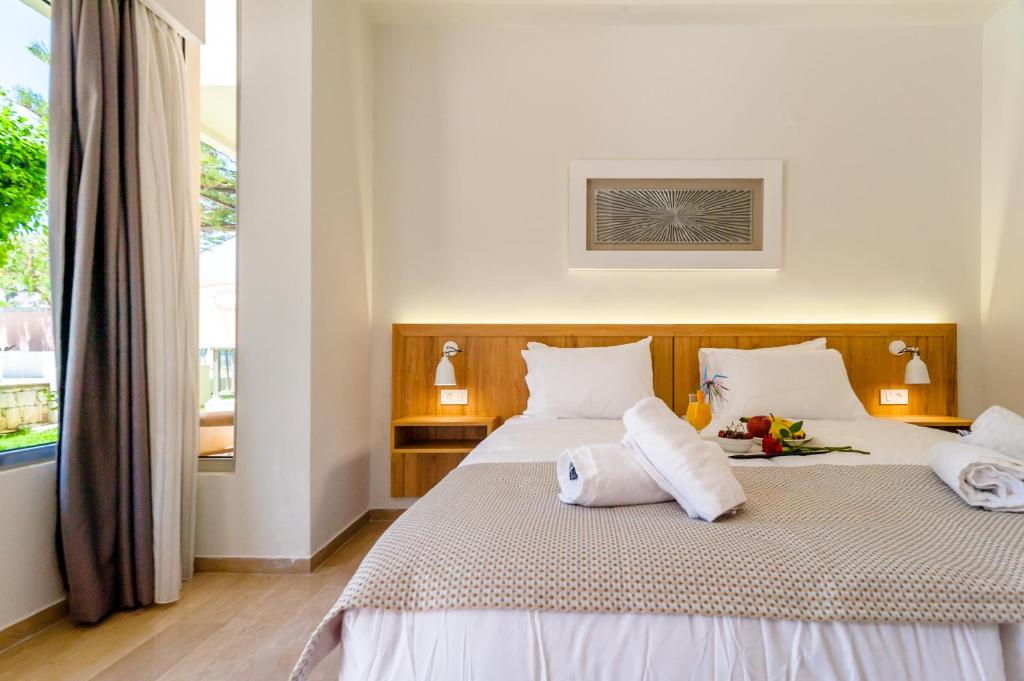 Posteľ alebo postele v izbe v ubytovaní Lotus Hotel Apartments