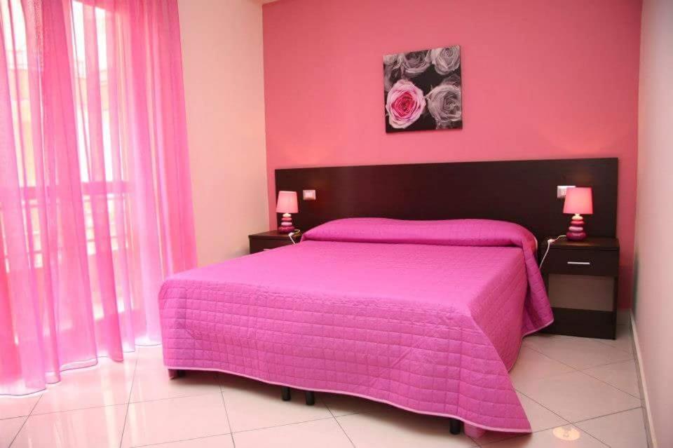En eller flere senge i et værelse på Essenza del Tempo