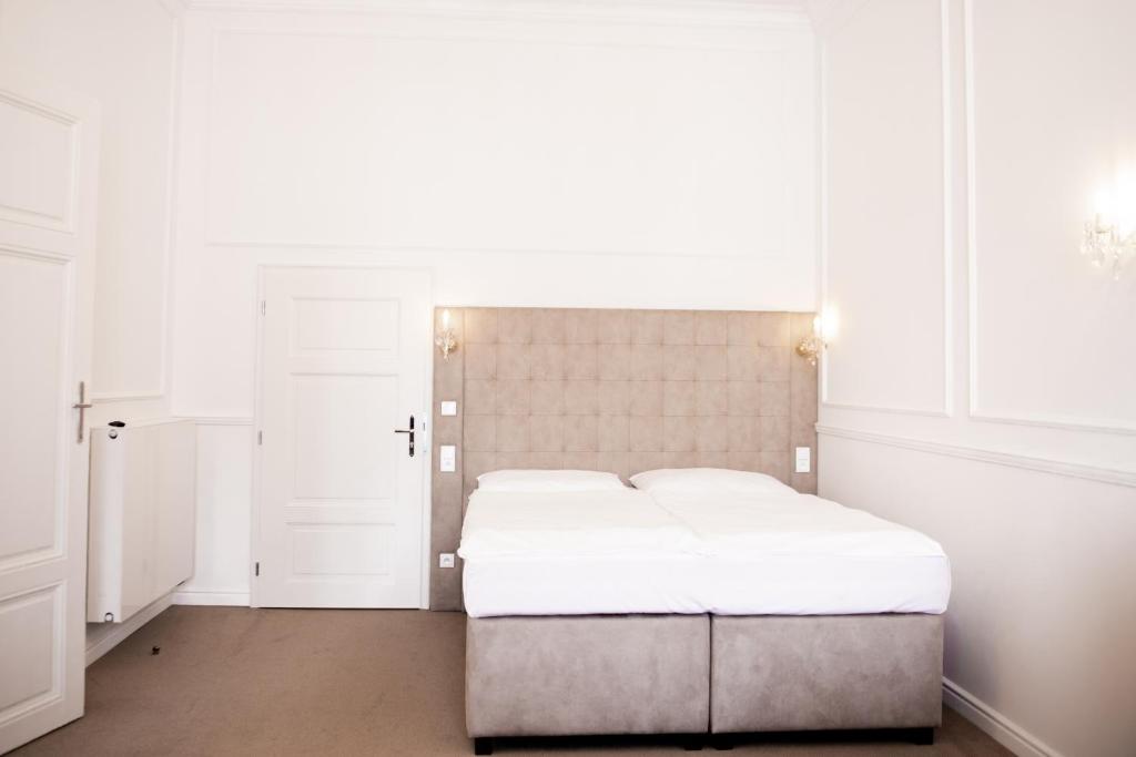 Postel nebo postele na pokoji v ubytování Apartmány Arte
