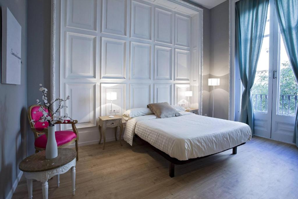 A bed or beds in a room at Violeta Boutique