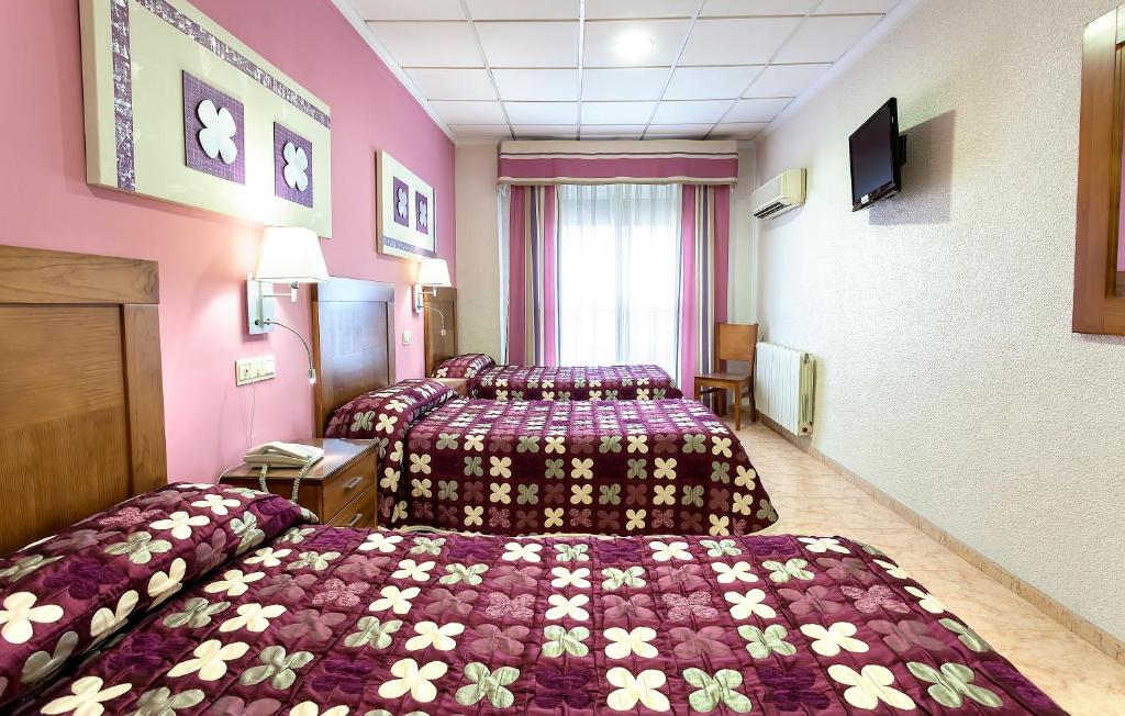 Postel nebo postele na pokoji v ubytování Manolo