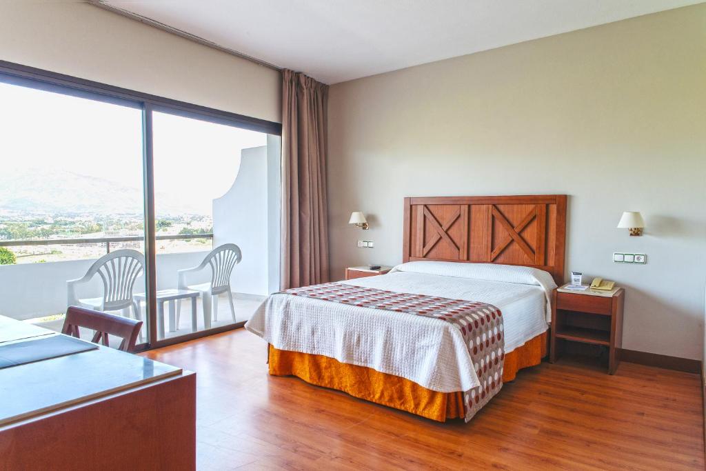 A bed or beds in a room at TRH Paraíso