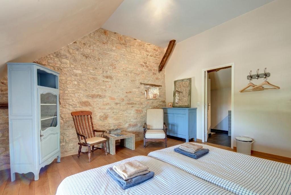 Postel nebo postele na pokoji v ubytování Chambres et table d'hôtes La Panacée