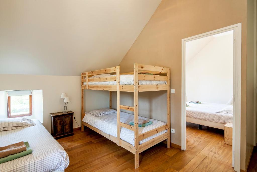 Postel nebo postele na pokoji v ubytování Chambres et table d'hôtes La Panacée
