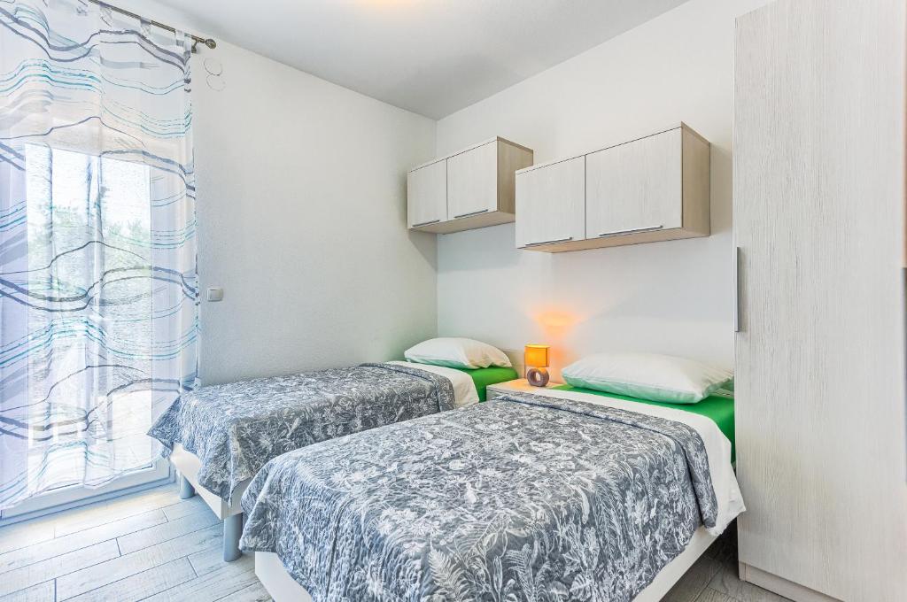 Apartments & Bungalows Ivanovićにあるベッド