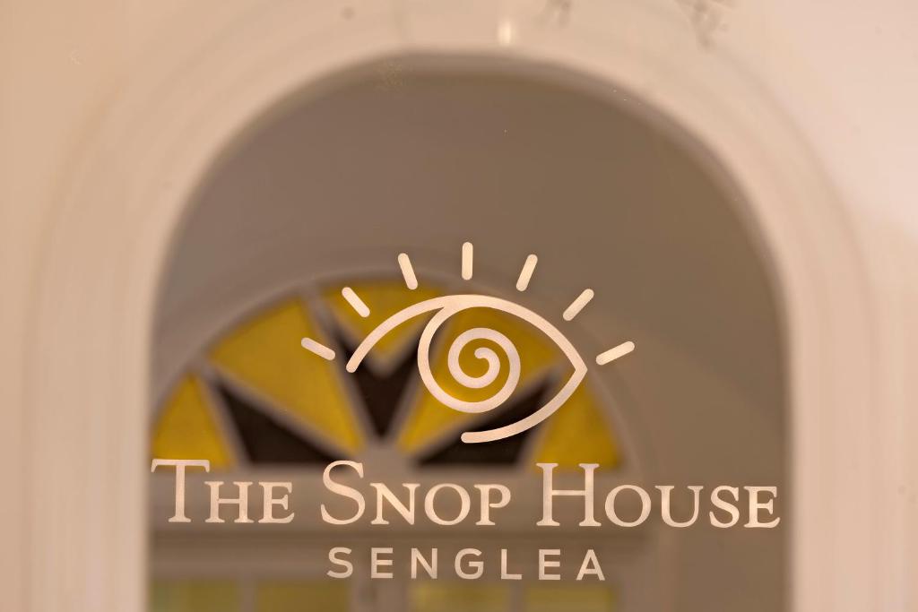 a window with the shop house svenezia on it at The Snop House in Senglea