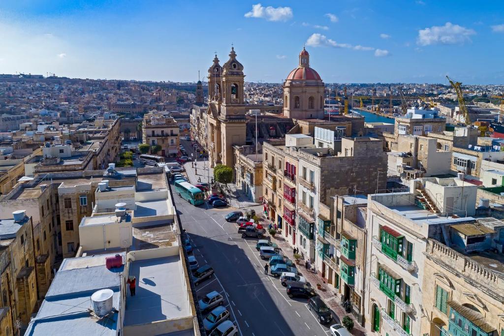 an aerial view of a city with buildings at The Snop House in Senglea
