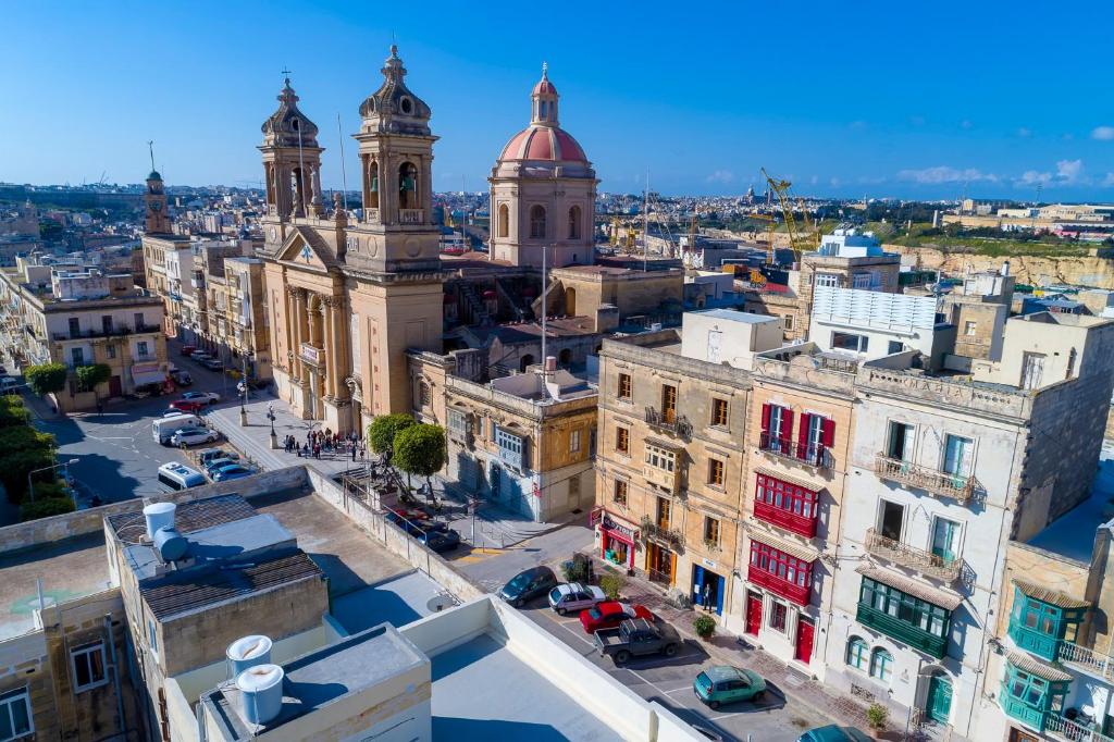 an aerial view of a city with buildings at The Snop House in Senglea