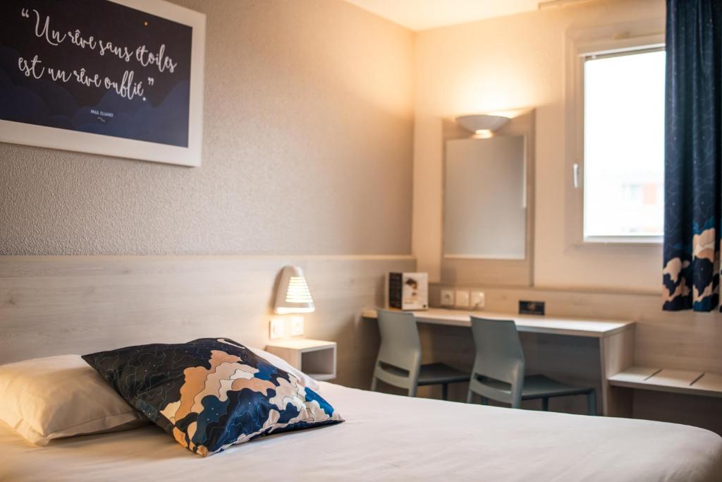 Postel nebo postele na pokoji v ubytování Ace Hôtel Toulouse Blagnac