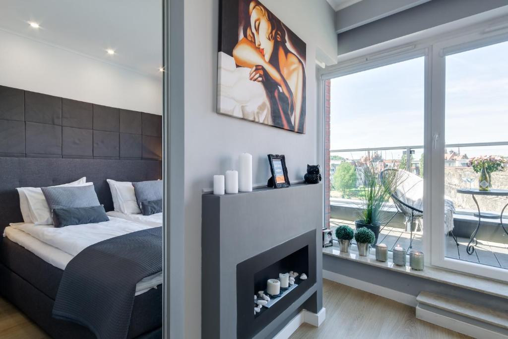 Posteľ alebo postele v izbe v ubytovaní Elite Apartments Chmielna Deluxe