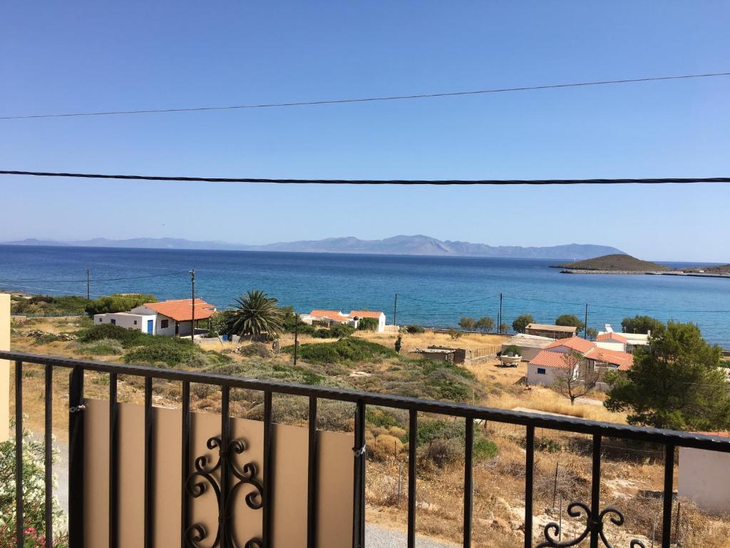 a view of the ocean from a balcony at Eugenia travasarou sea view appartments in Diakofti