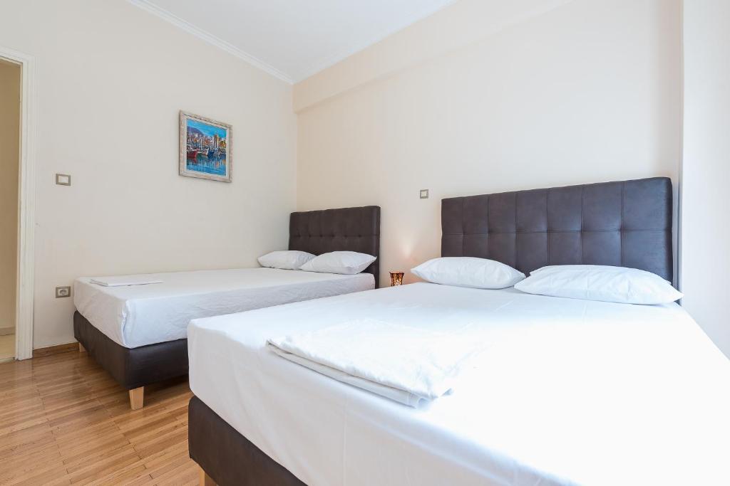 Postel nebo postele na pokoji v ubytování Victoria Familia Apartments