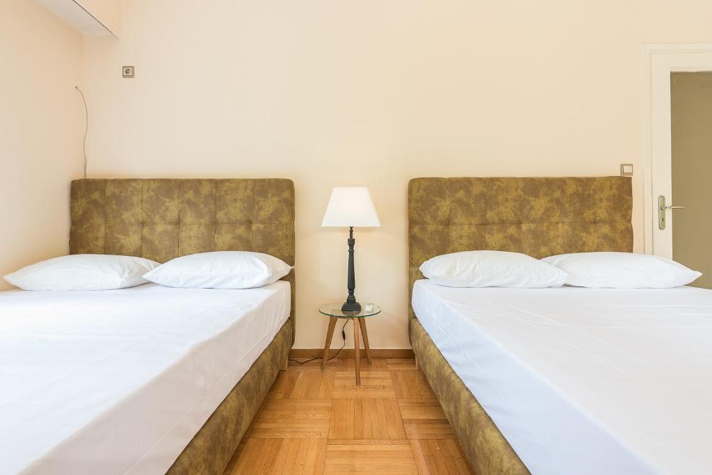 Postel nebo postele na pokoji v ubytování Victoria Familia Apartments