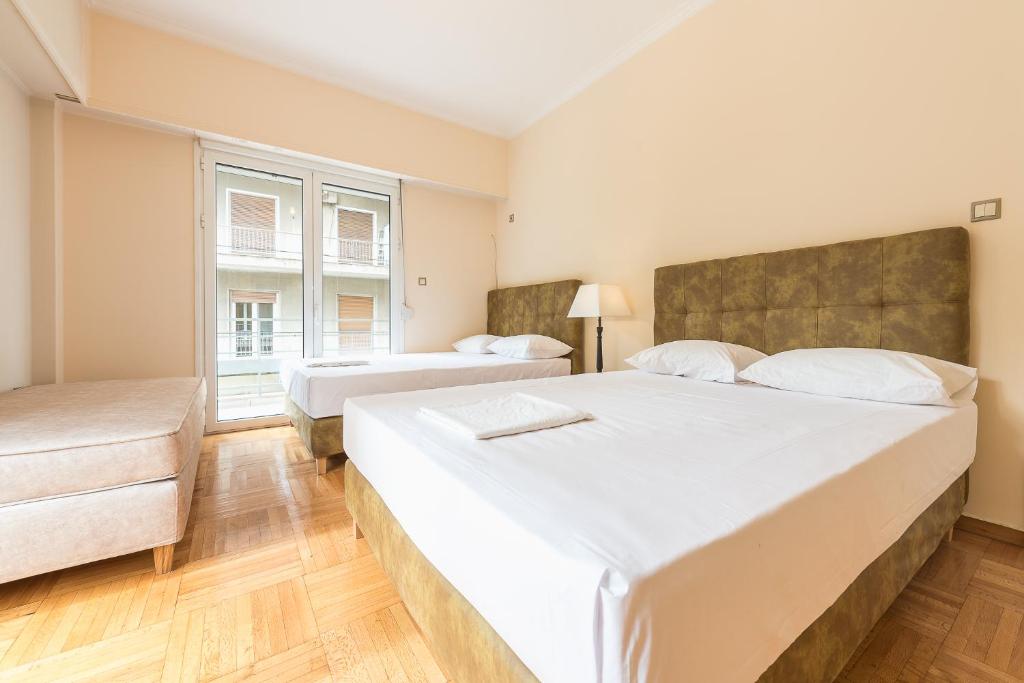 Postel nebo postele na pokoji v ubytování Victoria Familia Apartments