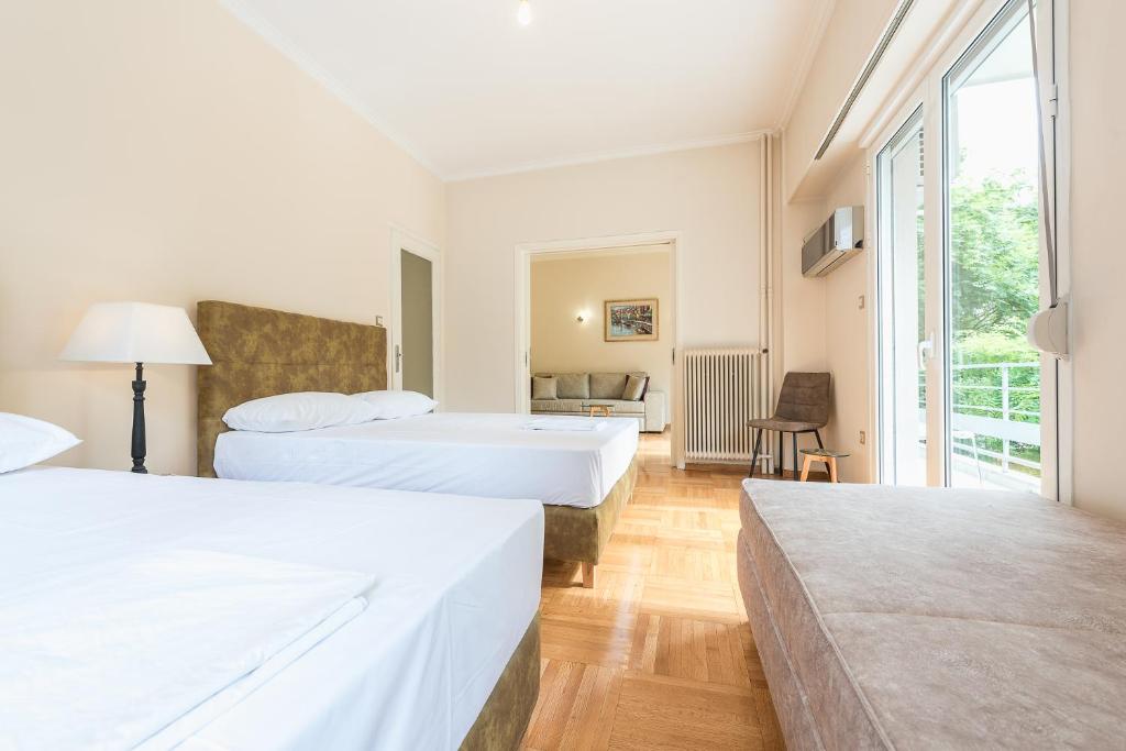 Postel nebo postele na pokoji v ubytování Victoria Familia Apartments