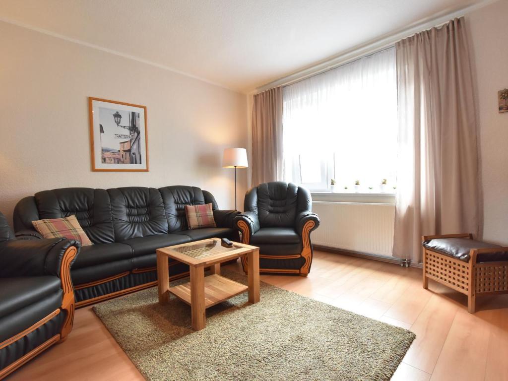 a living room with a couch and chairs and a table at Spacious Holiday Home in Wismar Germany with Parasol in Wismar