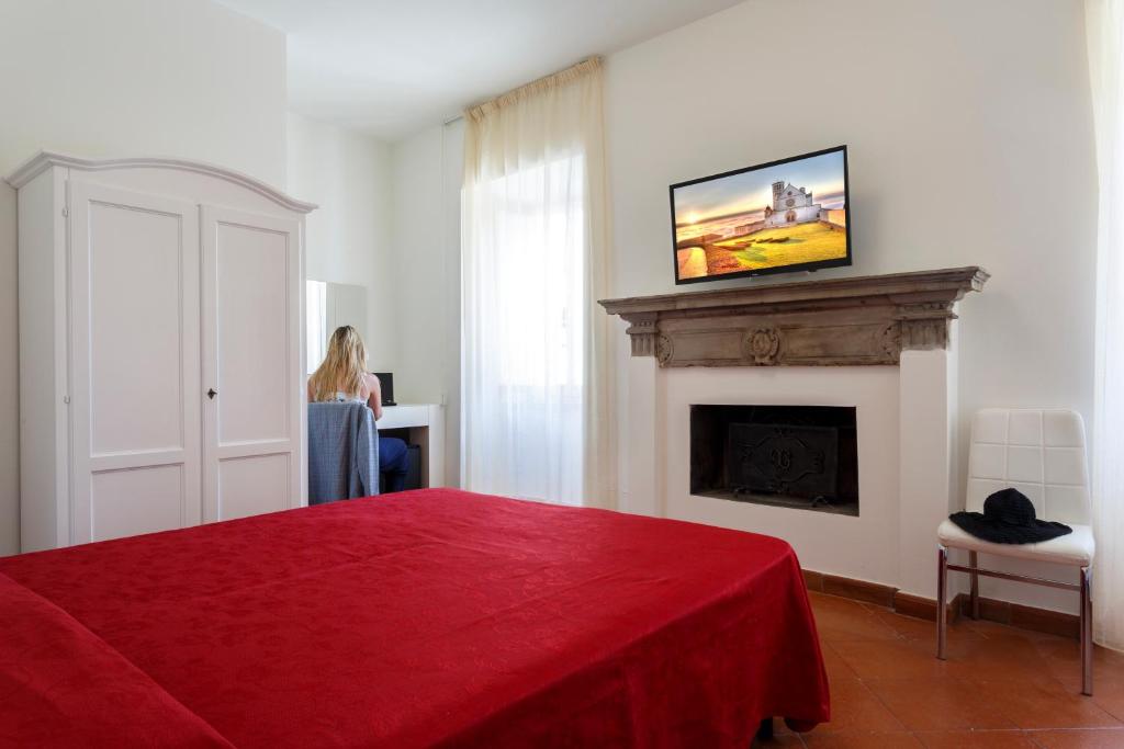 TV a/nebo společenská místnost v ubytování Hotel Il Duomo