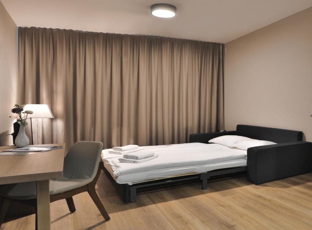 Postel nebo postele na pokoji v ubytování Ocak Aparthotel
