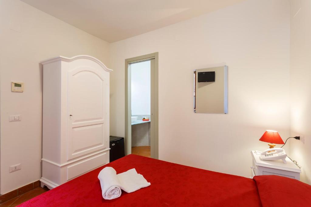 Postel nebo postele na pokoji v ubytování Hotel Il Duomo