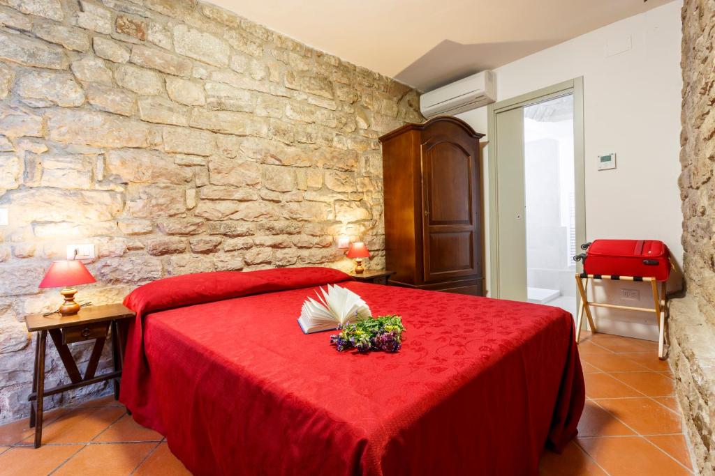 Postel nebo postele na pokoji v ubytování Hotel Il Duomo