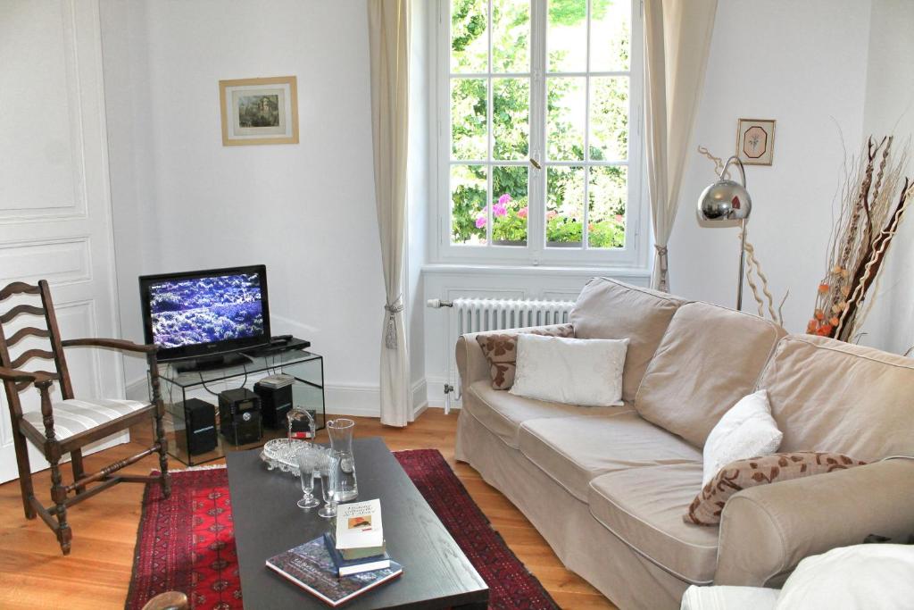 TV a/nebo společenská místnost v ubytování La Maison des Fontaines d'Alsace