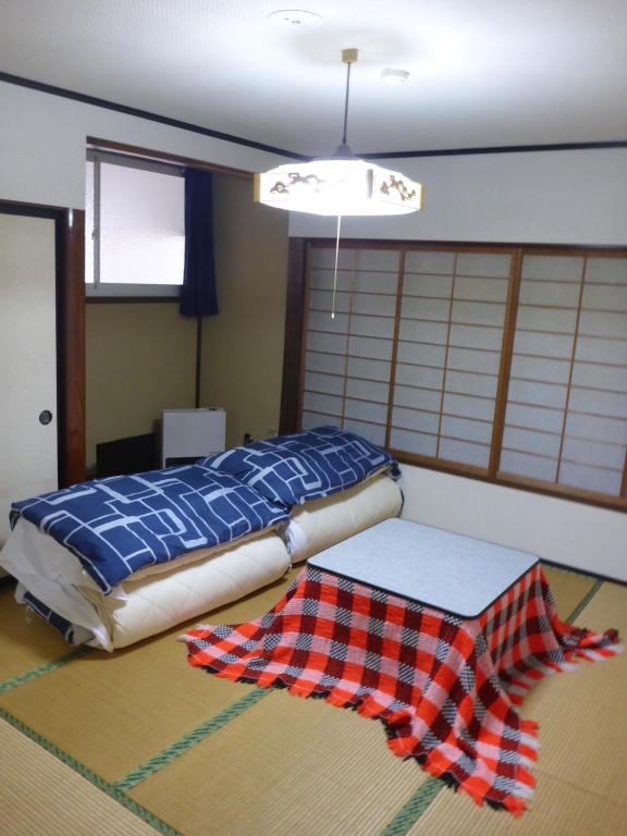 Postel nebo postele na pokoji v ubytování Nozawa Dream
