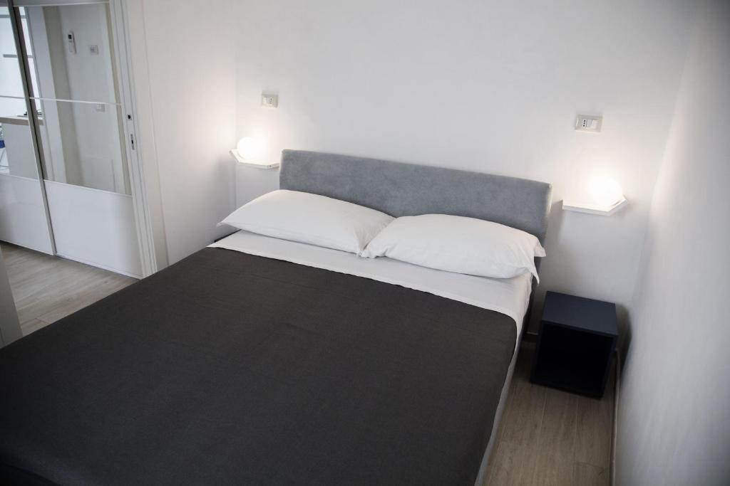 A bed or beds in a room at Tre Archi Apartment & Relais