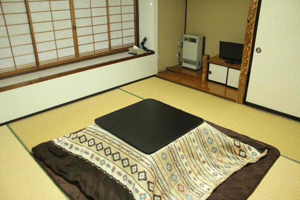 Postel nebo postele na pokoji v ubytování Nozawa Dream