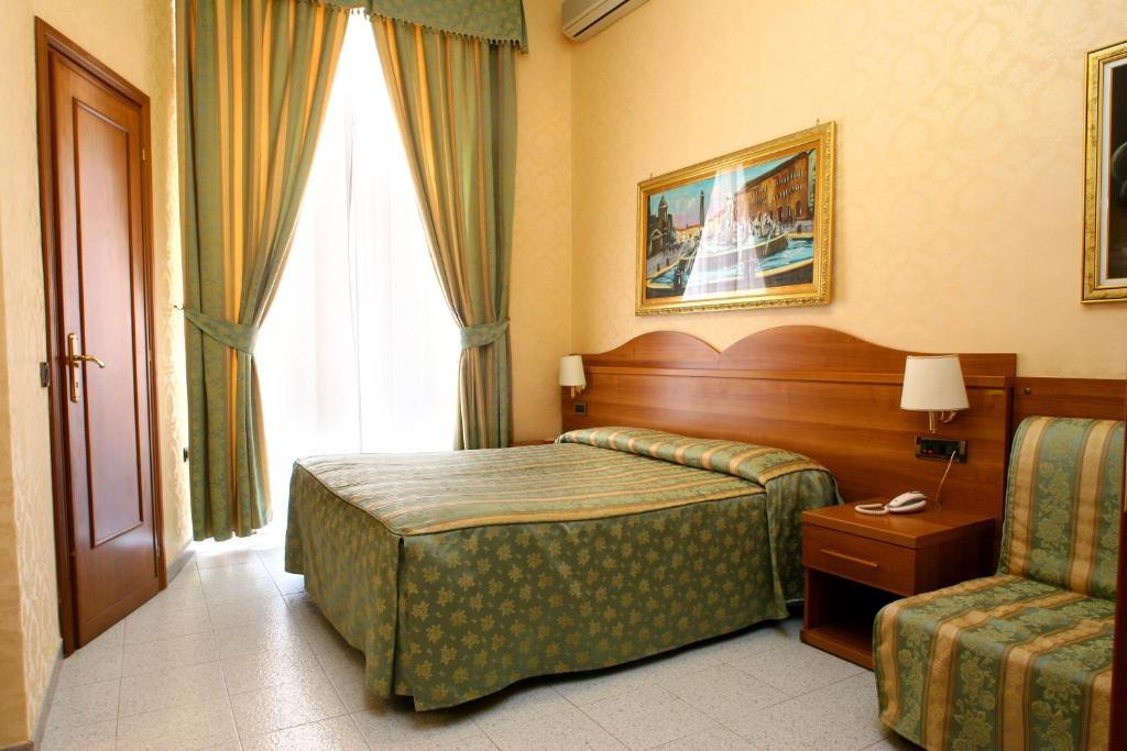 Postel nebo postele na pokoji v ubytování Hotel Teti