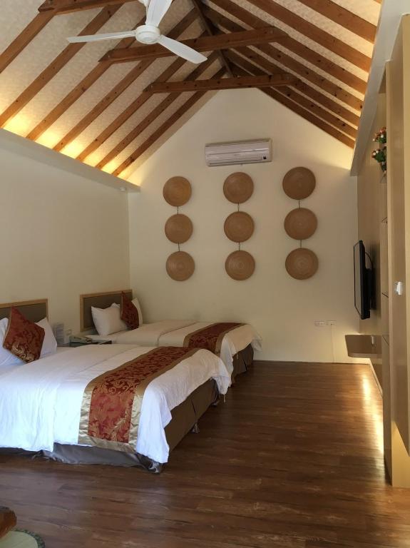 Postel nebo postele na pokoji v ubytování Shanze Bora villa