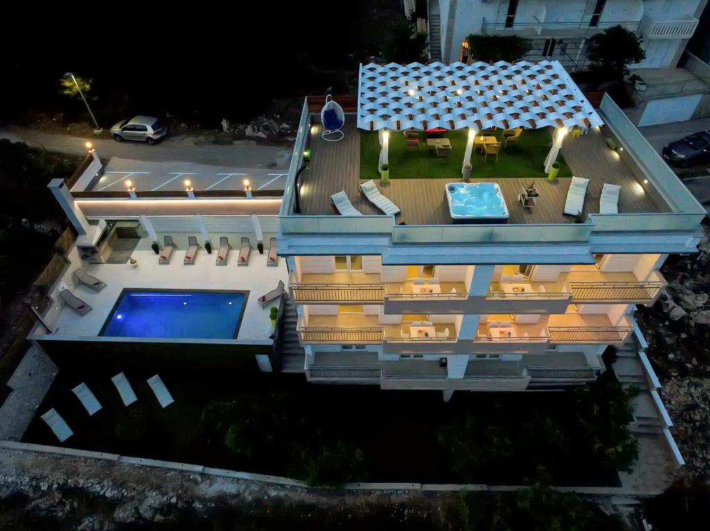 an aerial view of a house with a swimming pool at Apartments Villa Katija in Drvenik