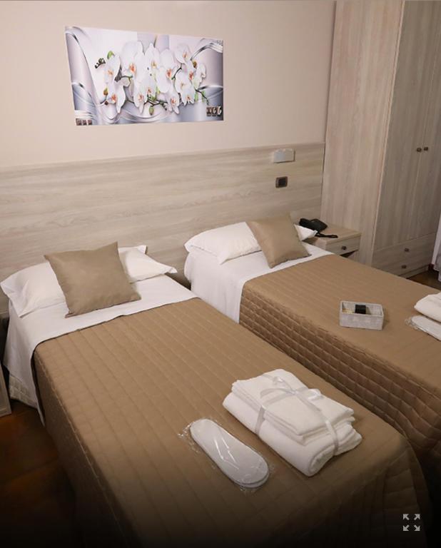 Postel nebo postele na pokoji v ubytování Policlinico Happy Home