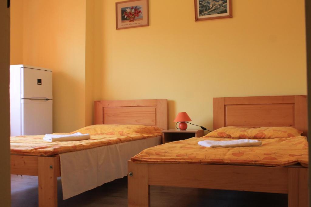 Postel nebo postele na pokoji v ubytování Király Szálló & Panzió