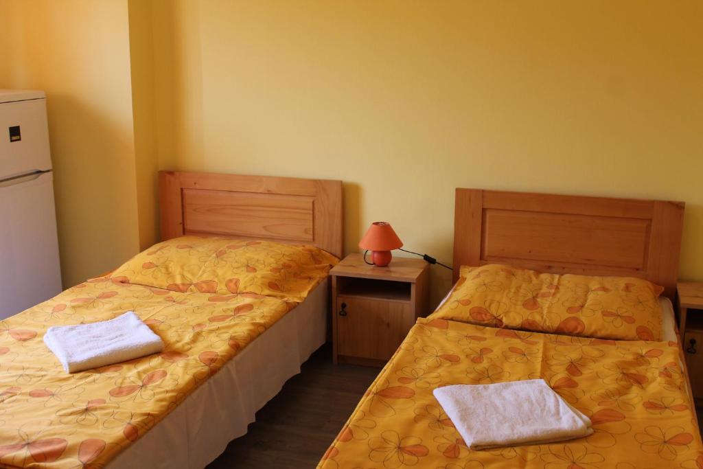 Postel nebo postele na pokoji v ubytování Király Szálló & Panzió