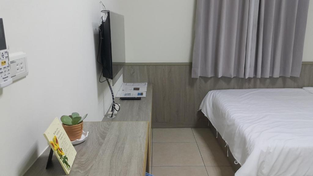 Postel nebo postele na pokoji v ubytování Yahweh Homestay
