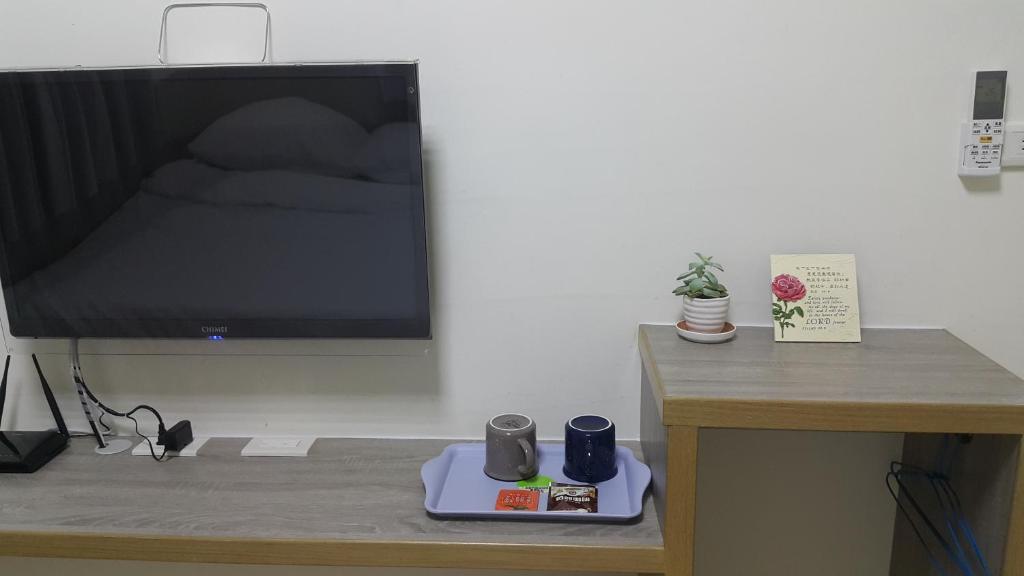 TV a/nebo společenská místnost v ubytování Yahweh Homestay