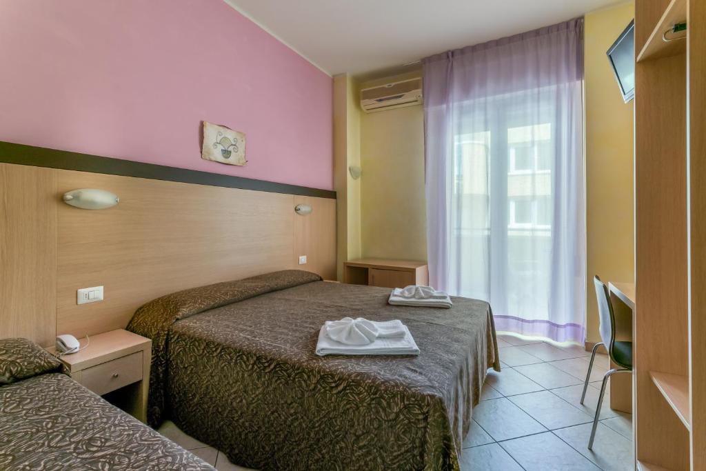 Postel nebo postele na pokoji v ubytování Hotel Rubens