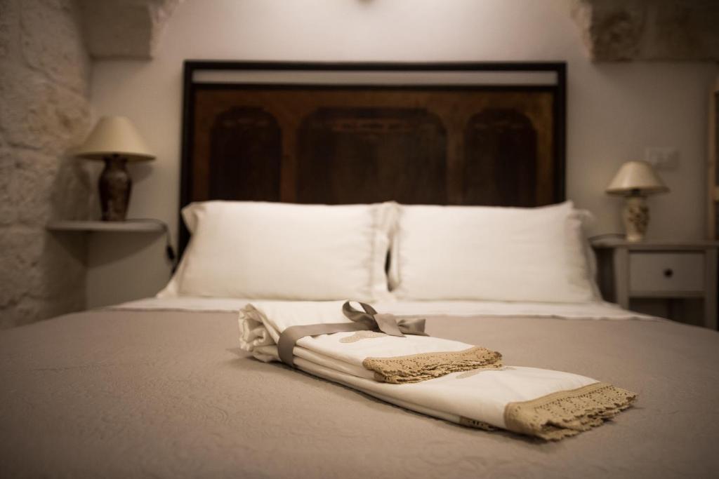 Postel nebo postele na pokoji v ubytování Al Caveau - Holiday House