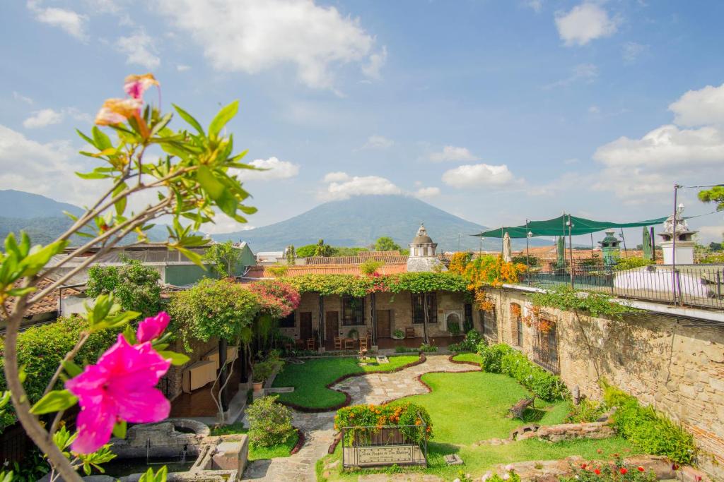 a view of a garden from the roof of a building at Hotel Posada de Don Rodrigo Antigua in Antigua Guatemala